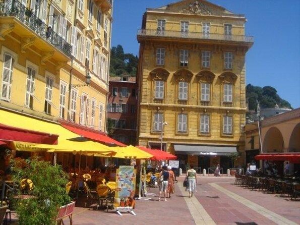 Nice City Segway Sightseeing Tour - Blue chairs, a small Statue of Liberty, and local symbols